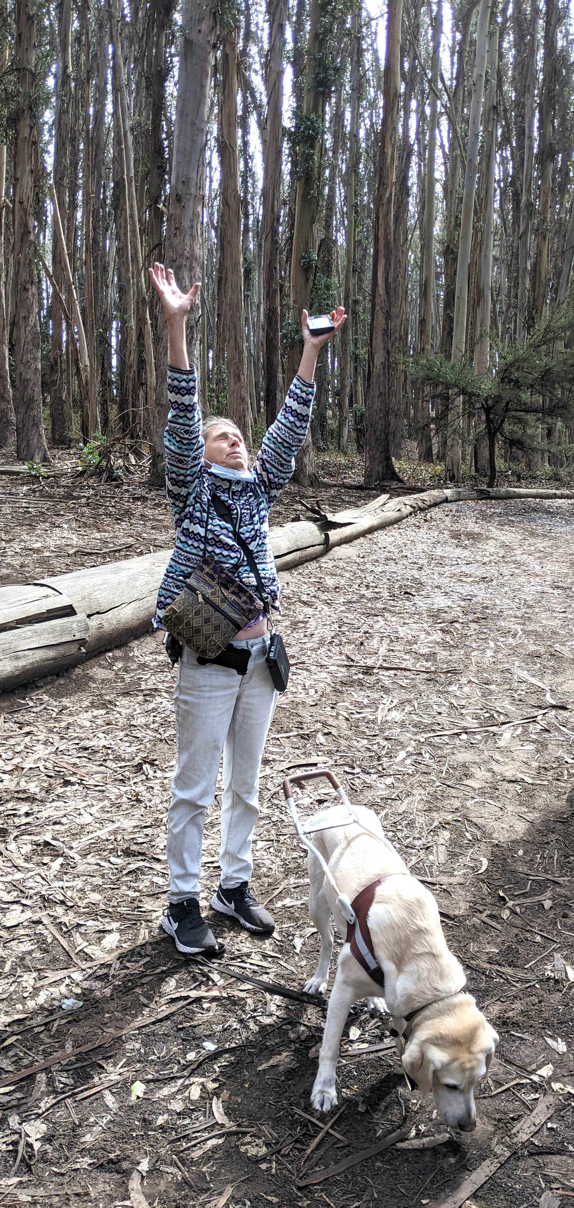 Photo of Testing Audio Description: American Council of the Blind member Susan Glass engages in an embodied audible moment in UniD's The Presidio: Goldsworthy Walk project, in San Francisco, CA (2021)